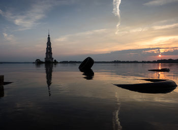 Scenic view of calm sea at sunset