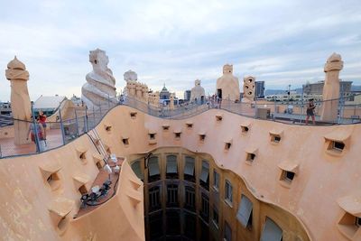 Panoramic view of buildings in city against sky