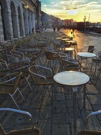 Empty chairs with buildings in background