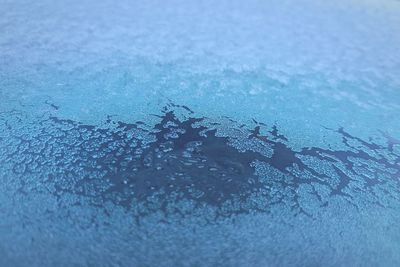 Full frame shot of water drops on car window