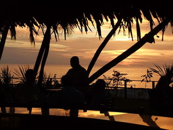 Silhouette of people at sunset