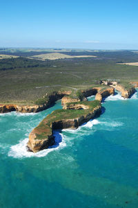 Aerial view of sea against blue sky