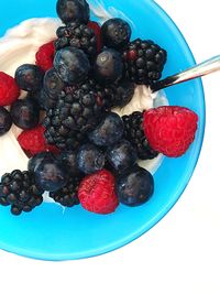 High angle view of strawberries in bowl on table