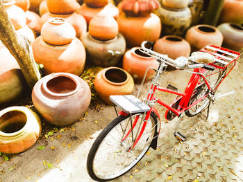 Bicycle parked by pots