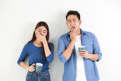 Young couple looking at camera