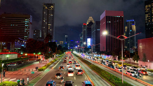 High angle view of traffic on city street at night