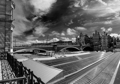 Panoramic view of bridge against cloudy sky