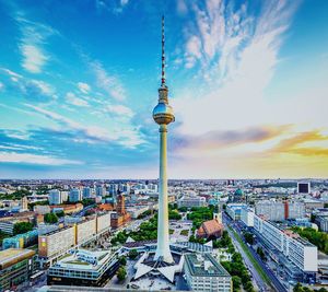 High angle view of communications tower and buildings in city