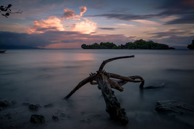 Scenic view of sea against sky at sunset