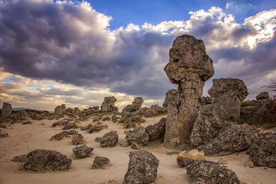 View of rock formation on land against sky