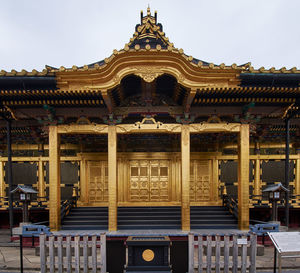 Facade of temple building against sky