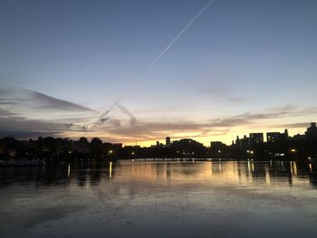 Scenic view of lake against sky during sunset