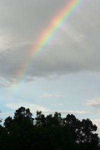 Low angle view of rainbow against sky