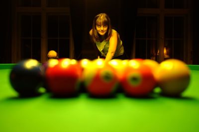 Portrait of woman playing snooker