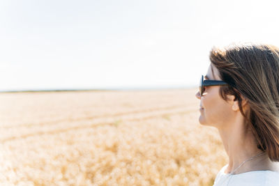 Summer concept, caucasian middle-aged woman in the countryside