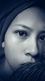 Close-up portrait of a serious young woman