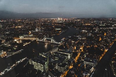 Aerial view of city lit up at night