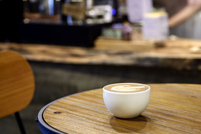 Close-up of coffee cup on table