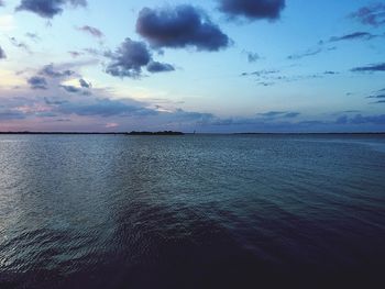 Scenic view of sea against cloudy sky