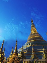 Low angle view of temple against blue sky