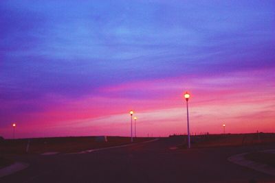 Road against cloudy sky at dusk