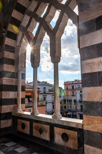 Buildings seen through arch window