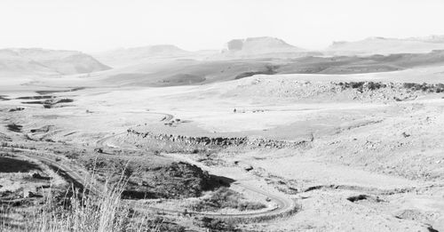 Scenic view of desert against clear sky