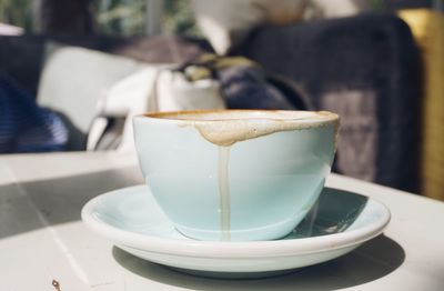 Close-up of coffee cup on table