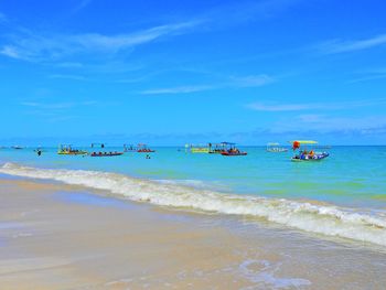 Scenic view of sea against blue sky