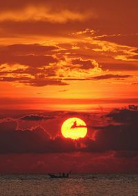 Scenic view of sea against romantic sky at sunset