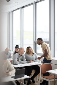 Teacher and adult students in class