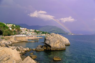 Scenic view of sea and rocks against sky