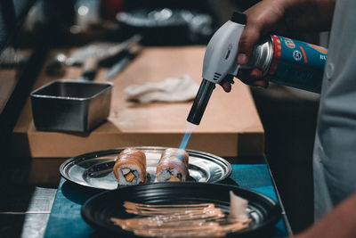 Close-up of man working on table