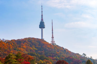 Low angle view of communications tower against sky