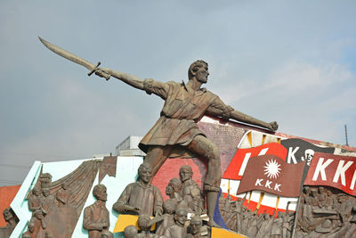 Low angle view of statue against sky