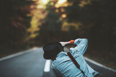 Rear view of man on road