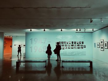 Silhouette people standing in corridor