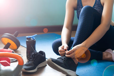 Low section of women sitting on floor