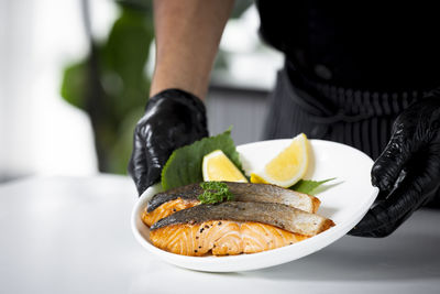 Midsection of man holding food