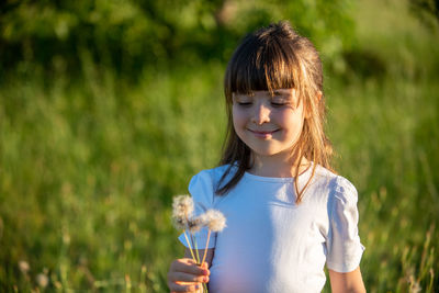 Portrait of girl holding flowers
