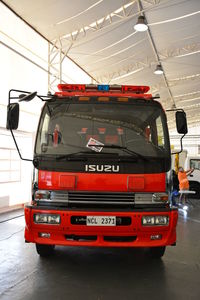 Red truck on road in city