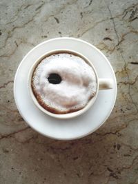 High angle view of coffee cup on table