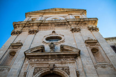 Low angle view of historic building against clear sky