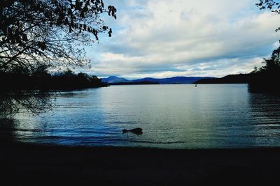 Scenic view of lake against sky during sunset