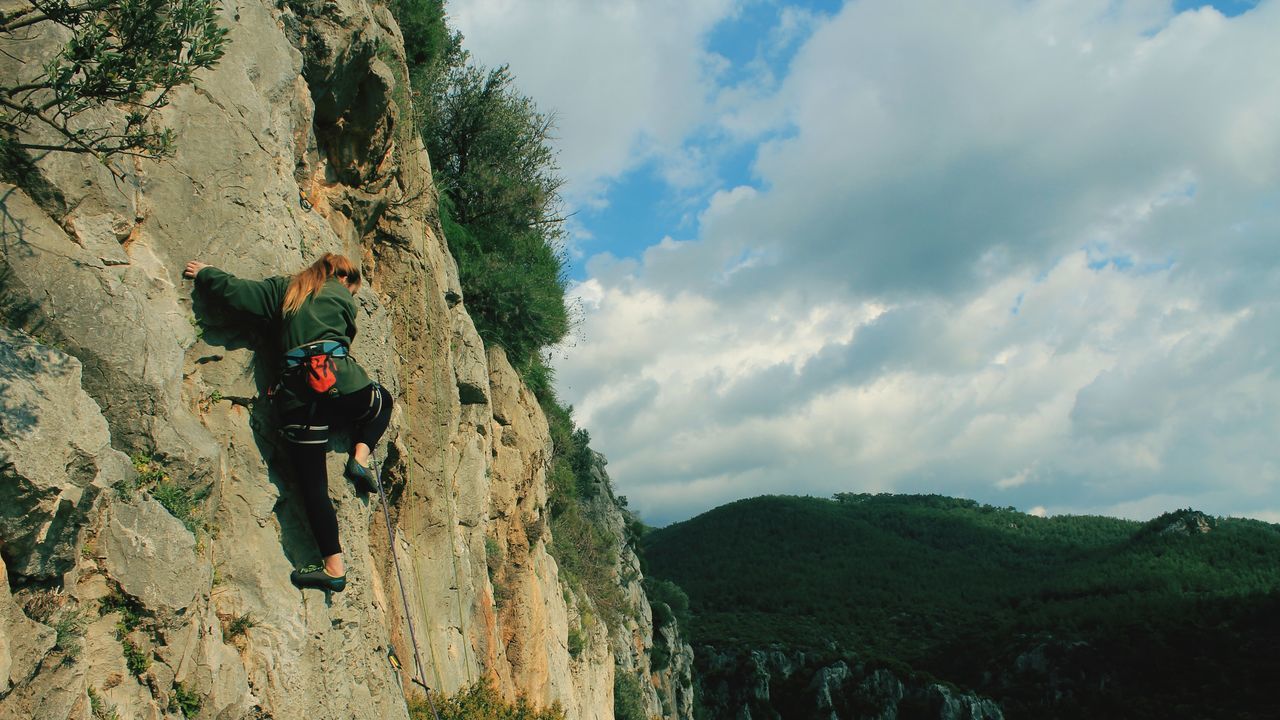 leisure activity, lifestyles, mountain, sky, men, hiking, full length, cloud - sky, rock - object, adventure, rear view, person, nature, tranquility, landscape, tree, backpack, beauty in nature