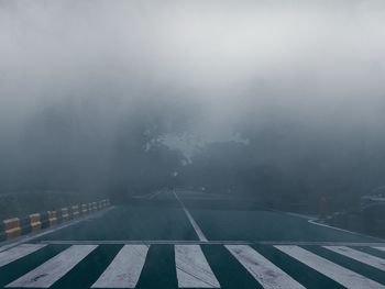 Road against sky during foggy weather