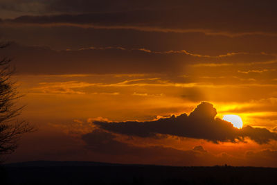 Scenic view of dramatic sky during sunset