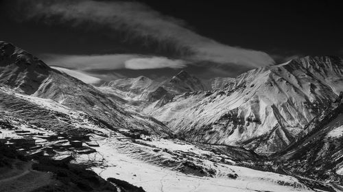 Scenic view of snowcapped mountains against sky