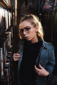 Portrait of young man reading book