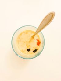 Directly above shot of breakfast on table against white background